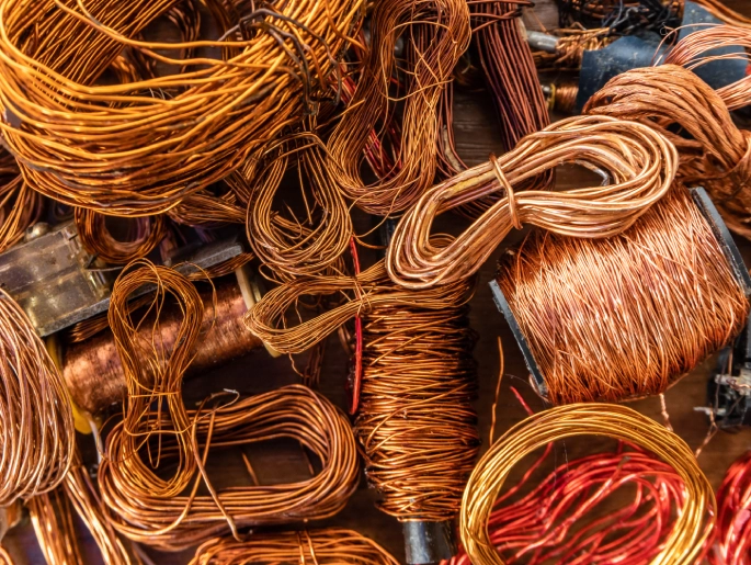 Insulated copper cables of different colours collected as scrap